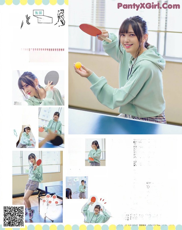 A woman in a green hoodie holding a ping pong paddle.