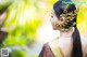 A woman in a traditional thai dress with a gold headpiece.